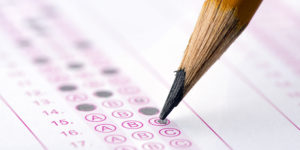 Multiple choice examination form with yellow pencil